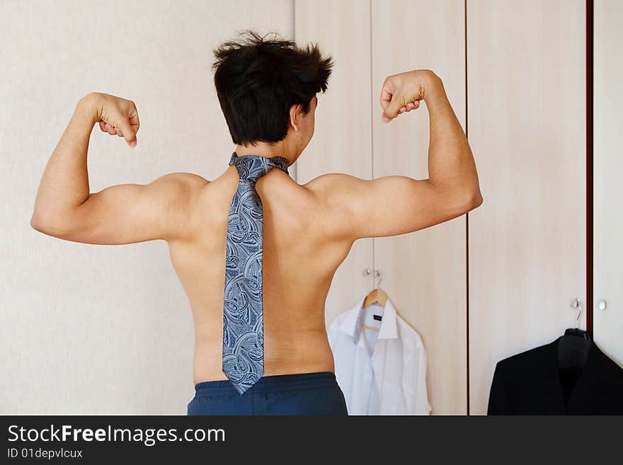 Man doing morning exersices with necktie. Man doing morning exersices with necktie