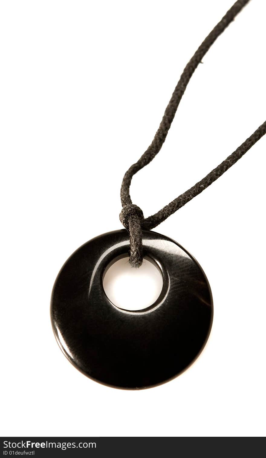 Black onyx pendent on white ground. Black onyx pendent on white ground