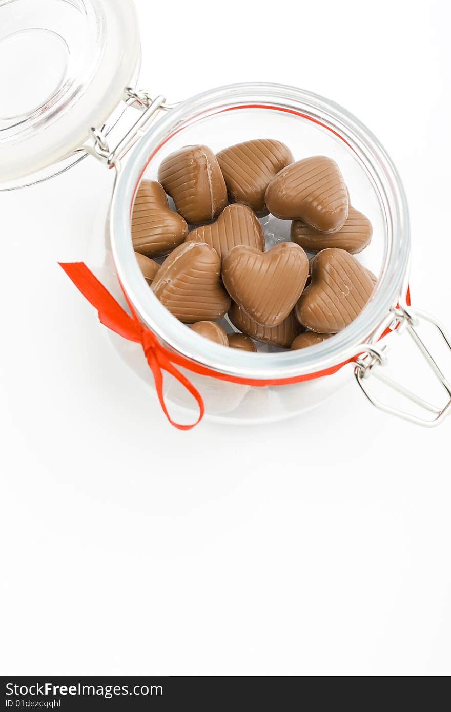 Heart shaped candies in a jar. Heart shaped candies in a jar