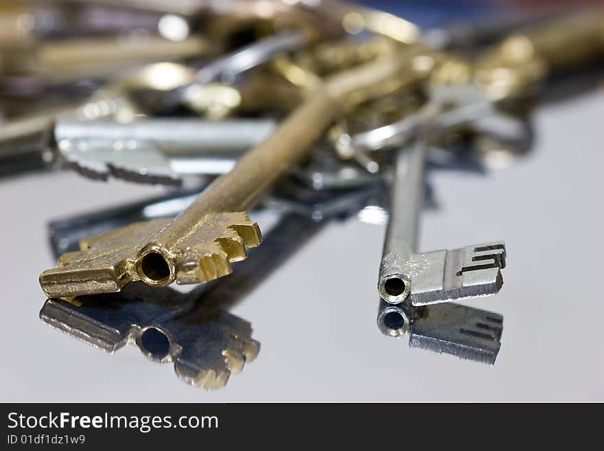 Bunch of keys on the surface of mirror