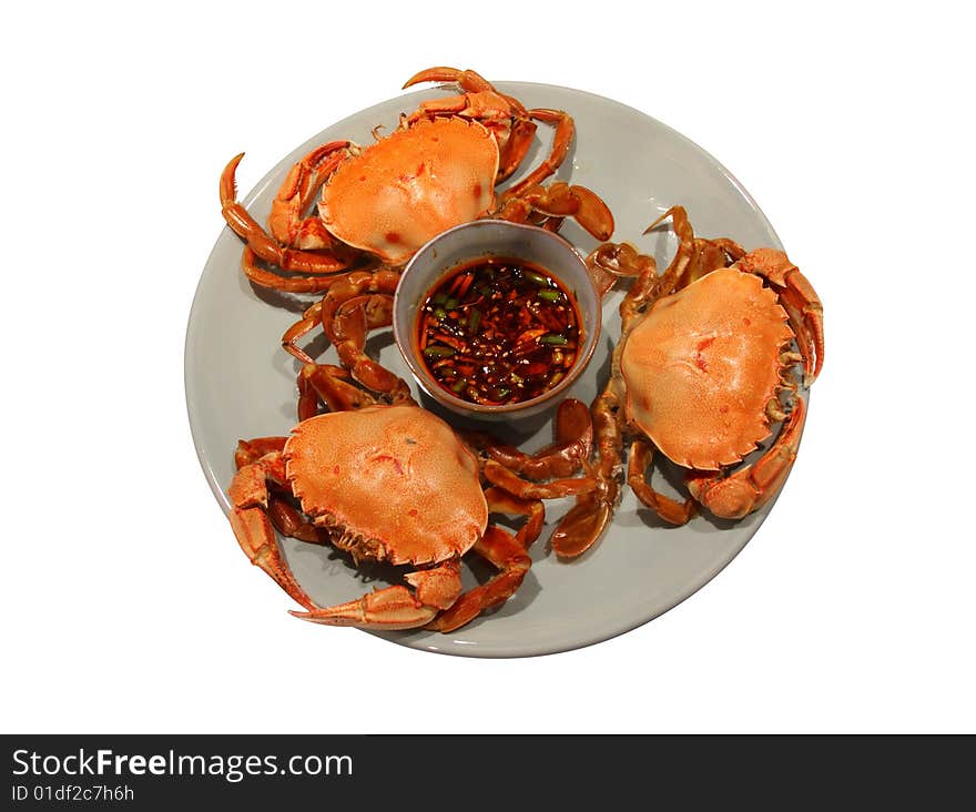 Steamed crabs served with ginger chili dipping sauce. Clipping path embedded. Steamed crabs served with ginger chili dipping sauce. Clipping path embedded.