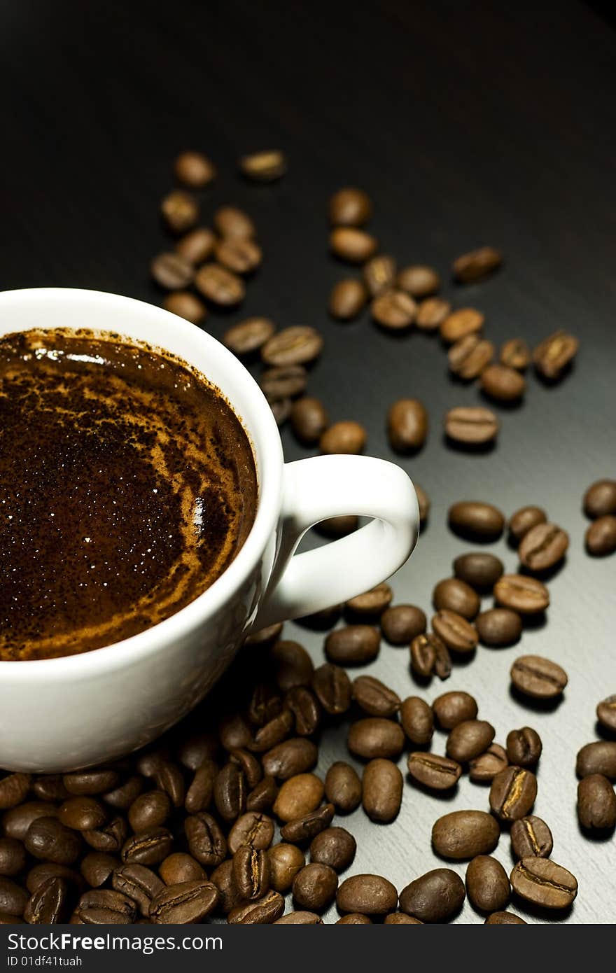 Close-up of Cup of coffee in warm lighting. Close-up of Cup of coffee in warm lighting