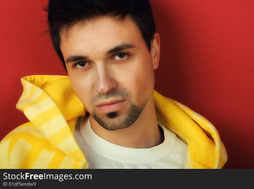 Portrait of Young Man on red background