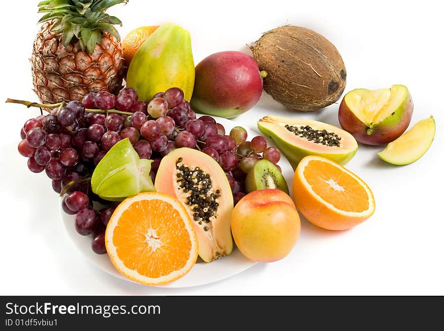 Healthy fruit assortment with papaya, kiwi, orange and grapes