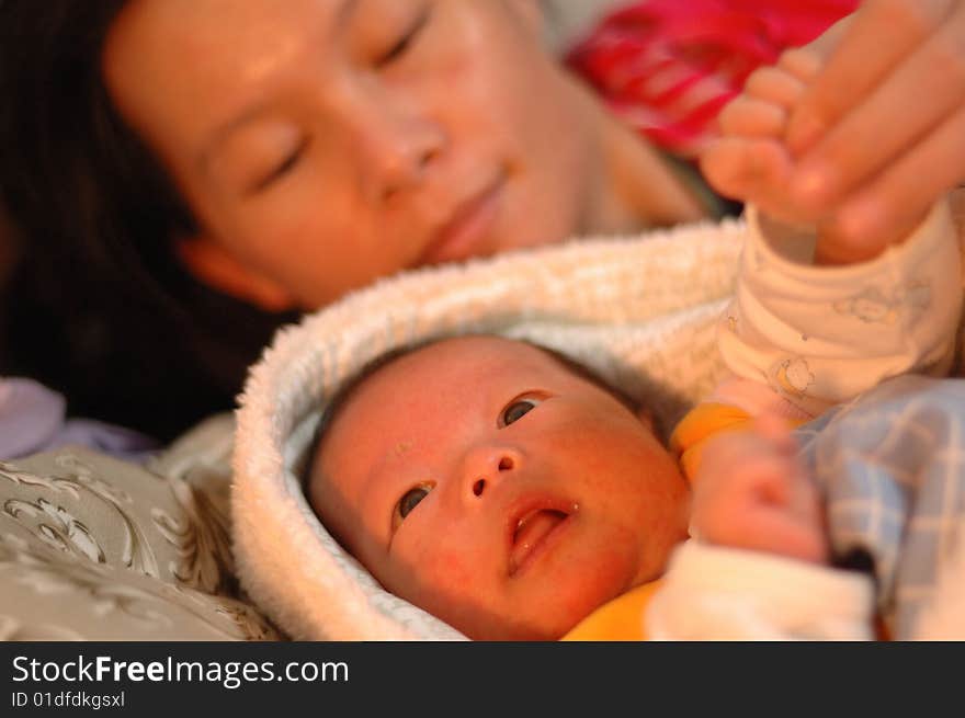 A warm scene of baby and mother.