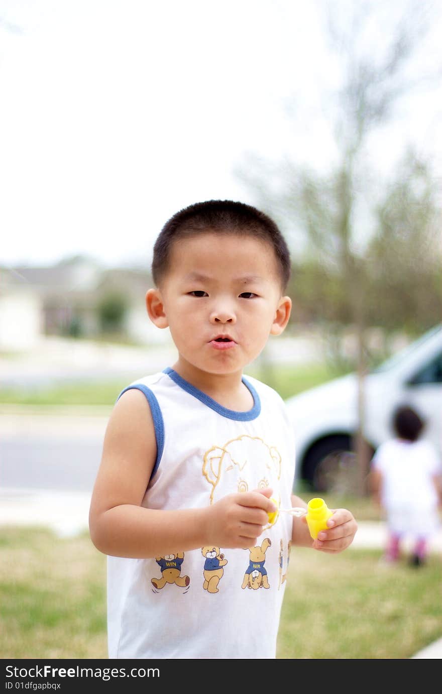 He is a little Chinese boy. He is a little Chinese boy.