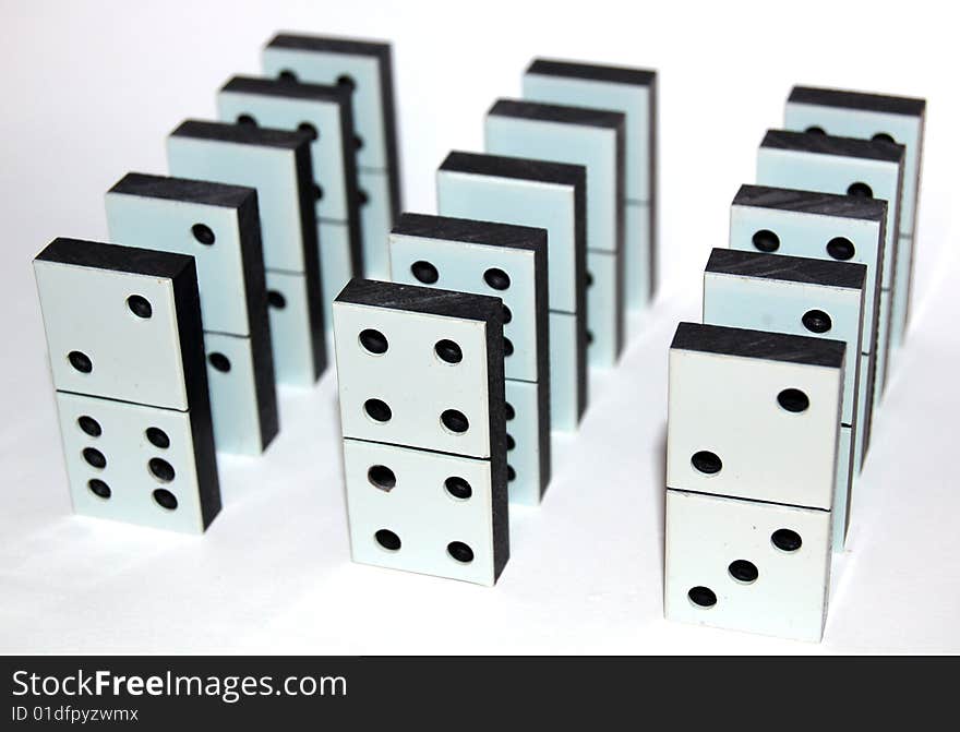 White domino stones on white background