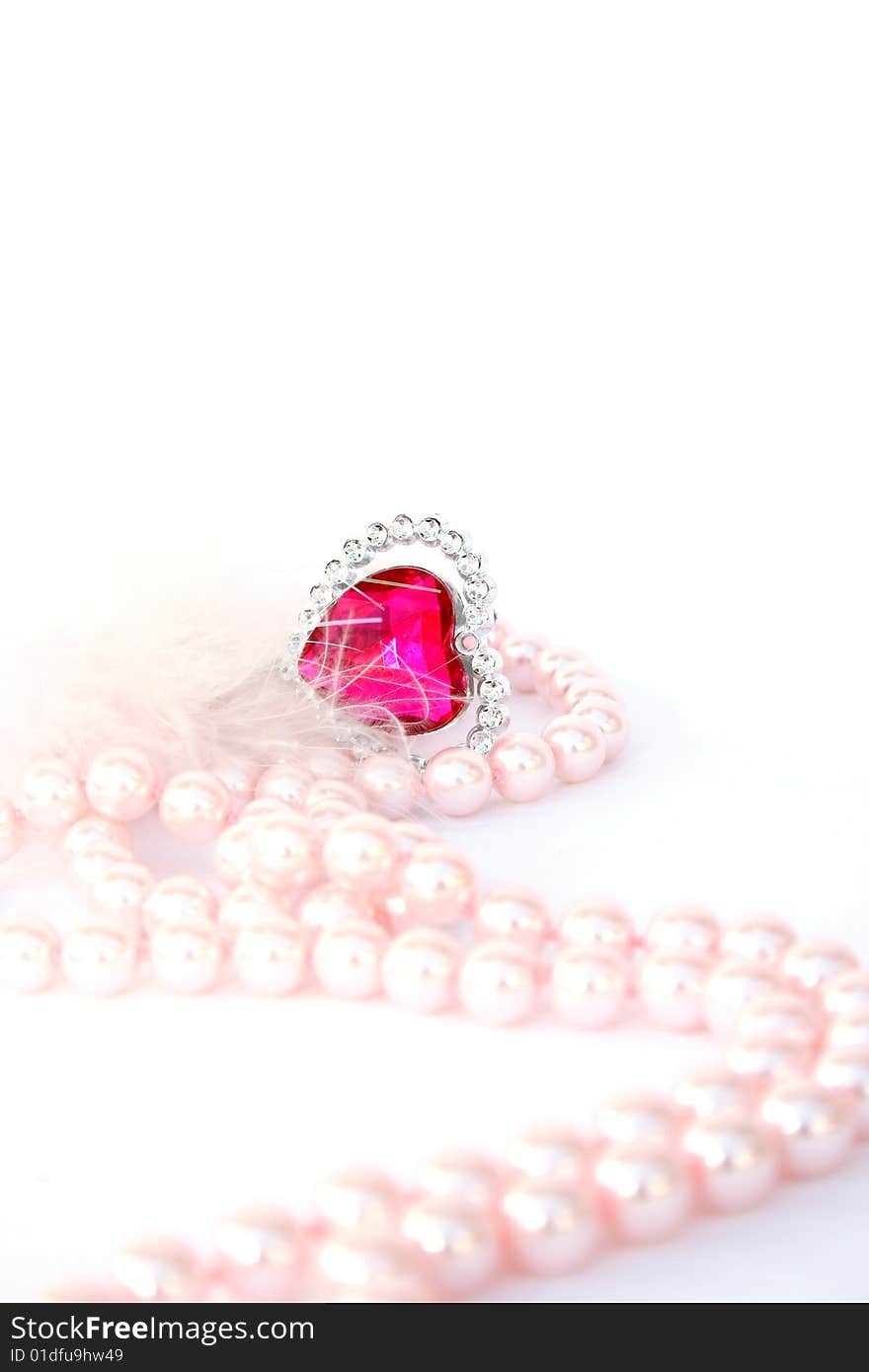 Red heart stone and pink pearls. Red heart stone and pink pearls.