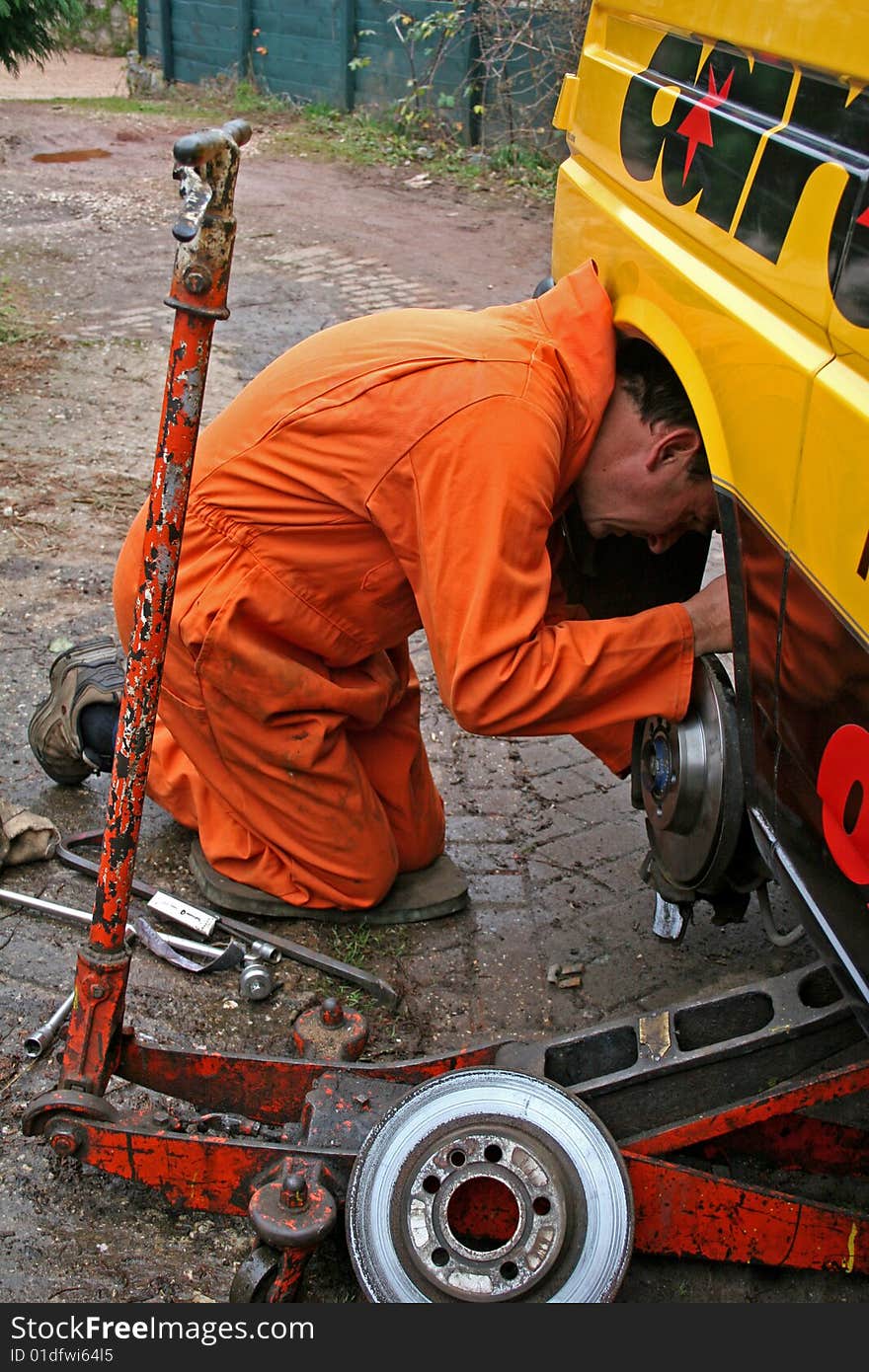 Mechanic changing brake disc