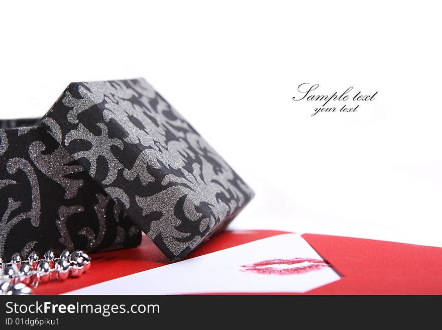 Black gift box and a letter with a lipstick kiss. Black gift box and a letter with a lipstick kiss