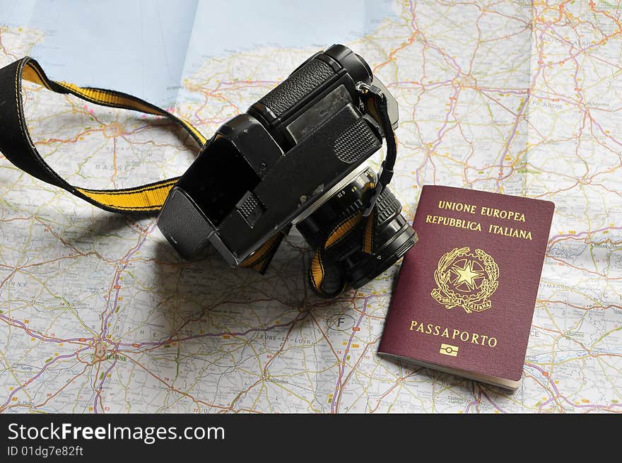 Map, passport and camera, preparing for a trip