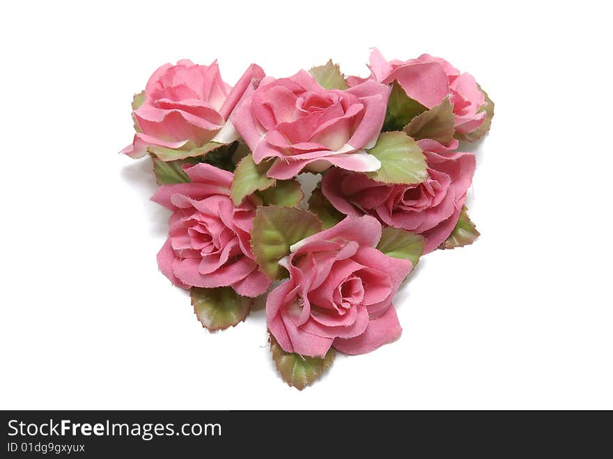 Heart made of roses isolated in white