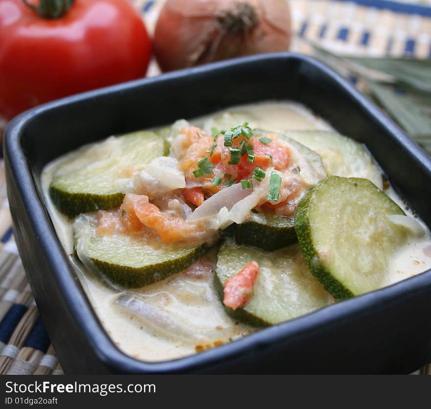 A stew of fresh zucchini with tomatoes