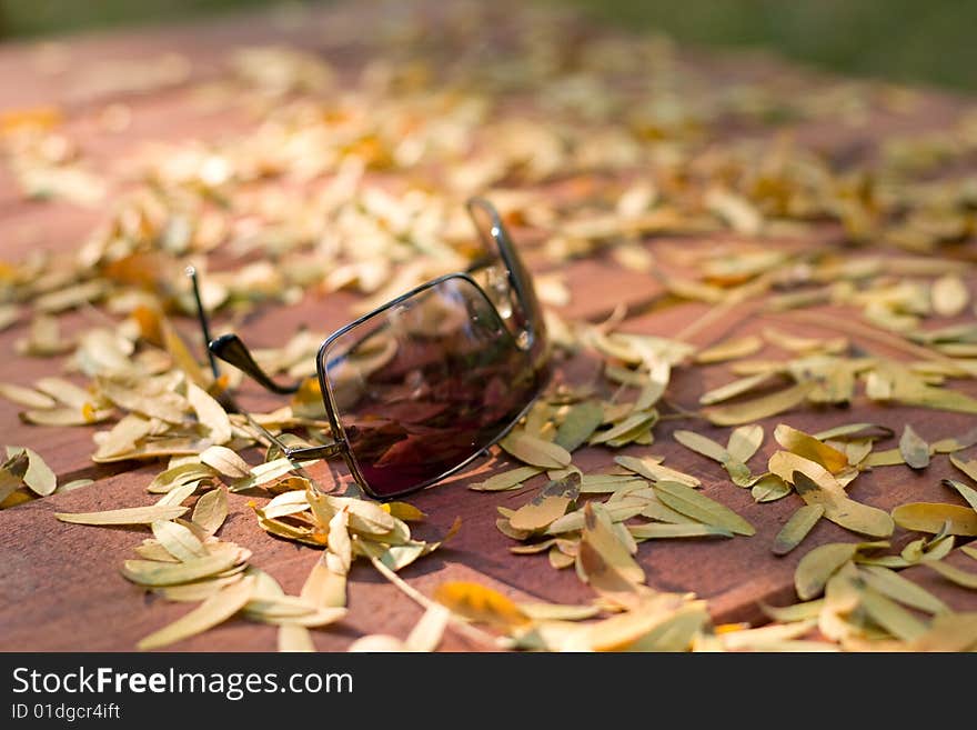 Sunglasses on wooden table