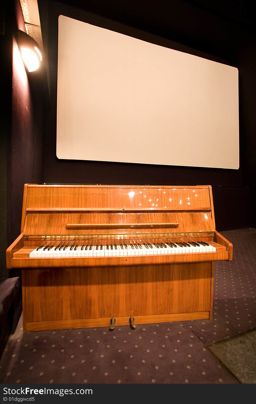 Empty cinema auditorium and a piano