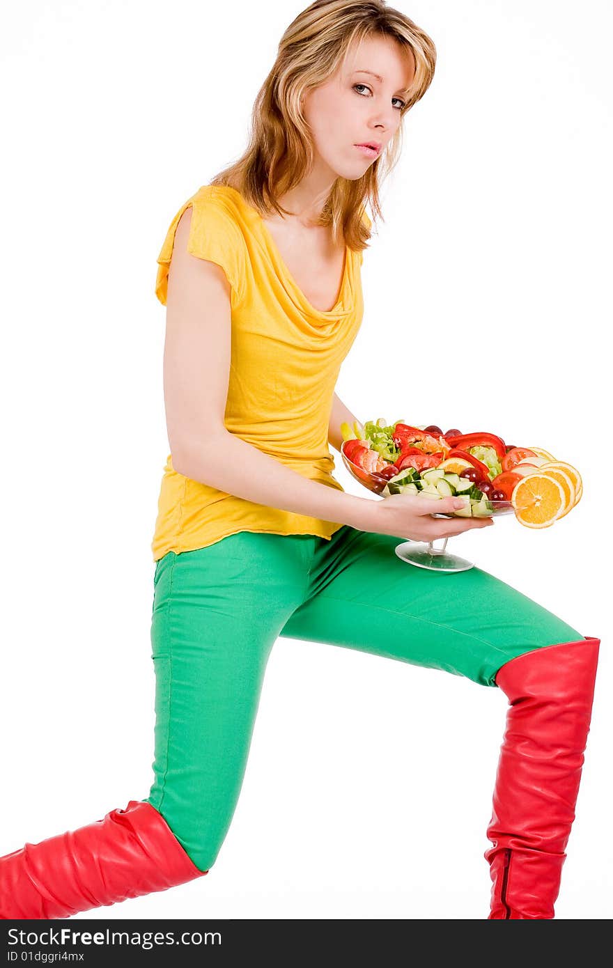 Young girl is posing with a delicious salad. Young girl is posing with a delicious salad