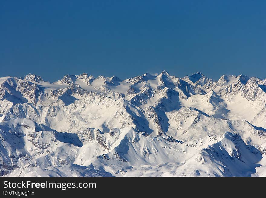 Bright sunny day. Winter mountains.