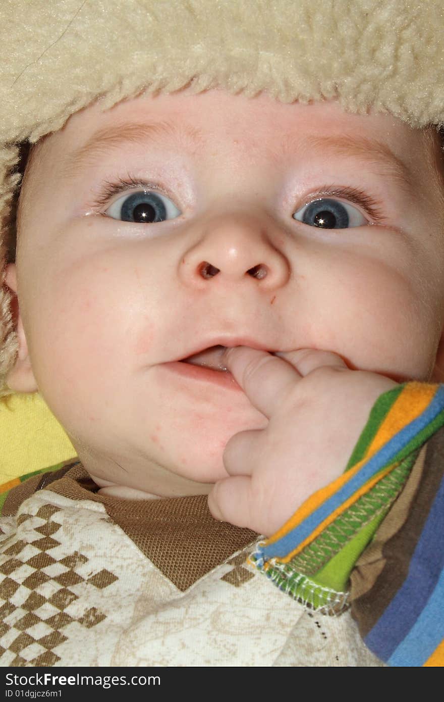 Close up portrait of infant with funny expression. Close up portrait of infant with funny expression