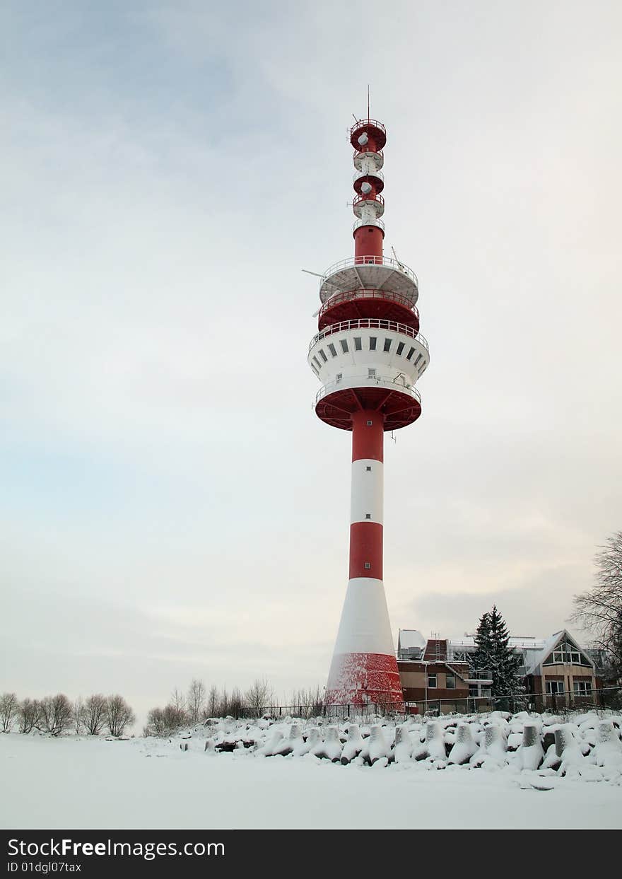 Beacon on a coast of the Finnish gulf in the winter. Peterhof . Beacon on a coast of the Finnish gulf in the winter. Peterhof