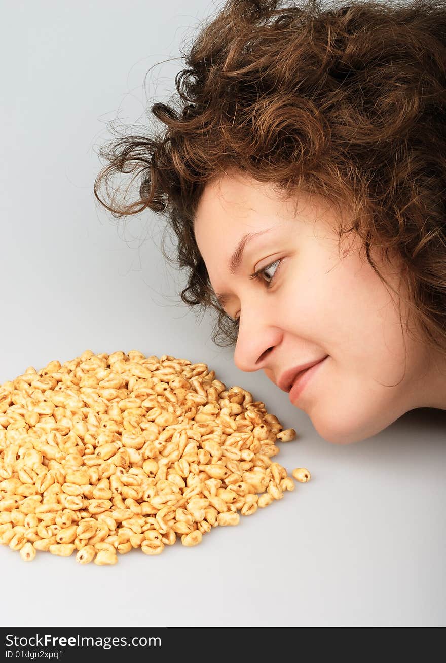 Popped wheat grains and girl