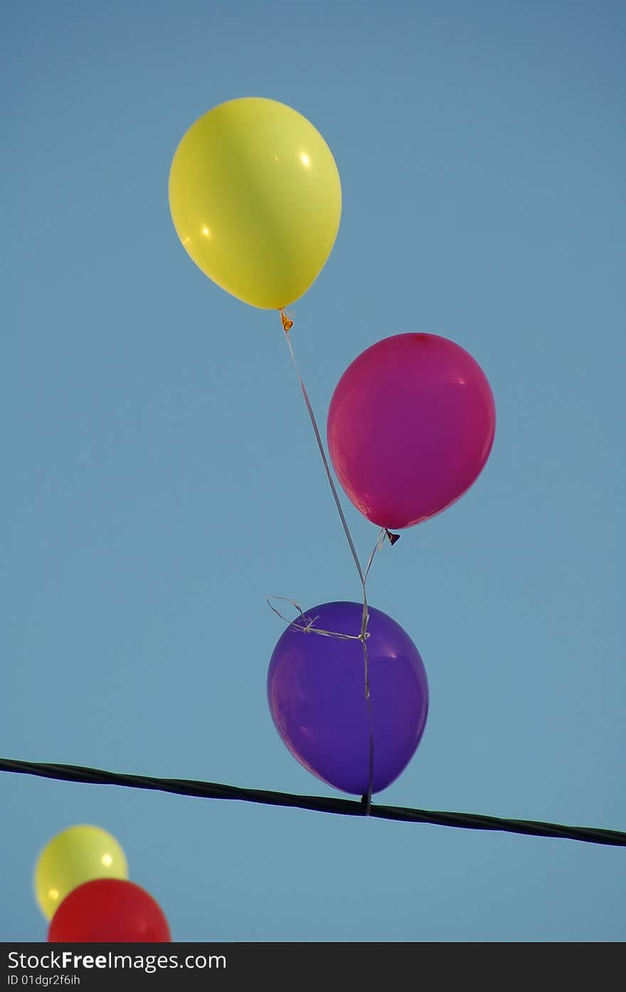 The three flying balloons. Red yellow ...