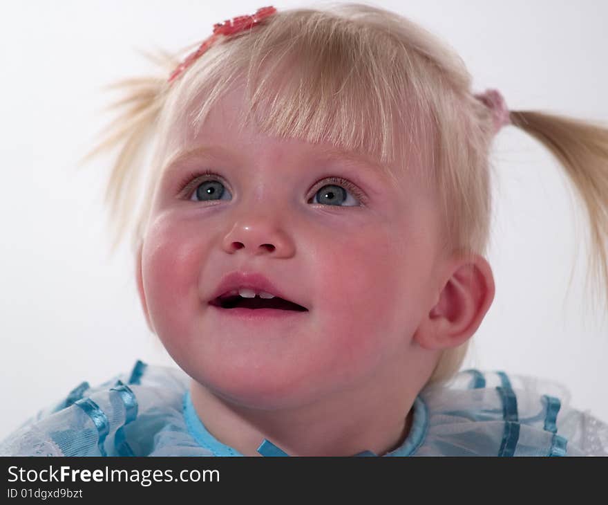 Blond girl in blue gown smile. Blond girl in blue gown smile