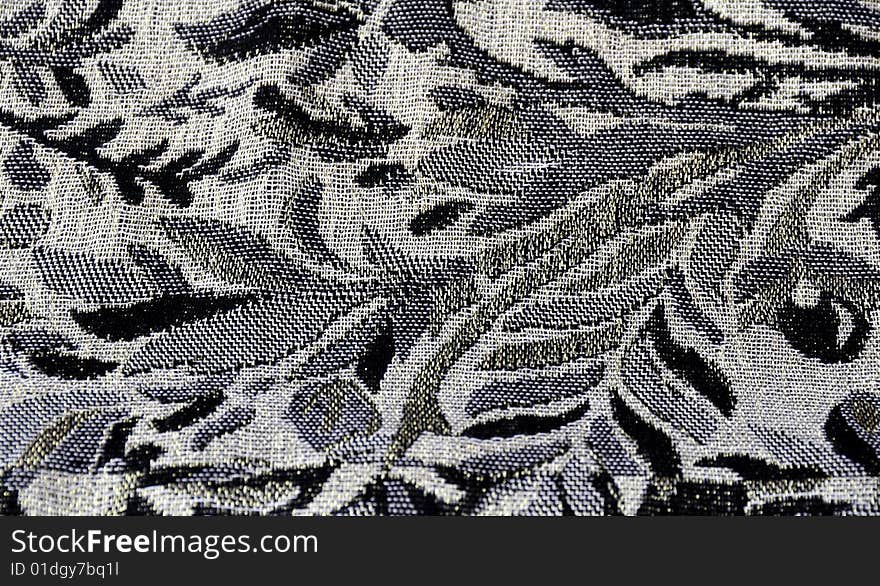 A close up shot of some black and grey material. A close up shot of some black and grey material