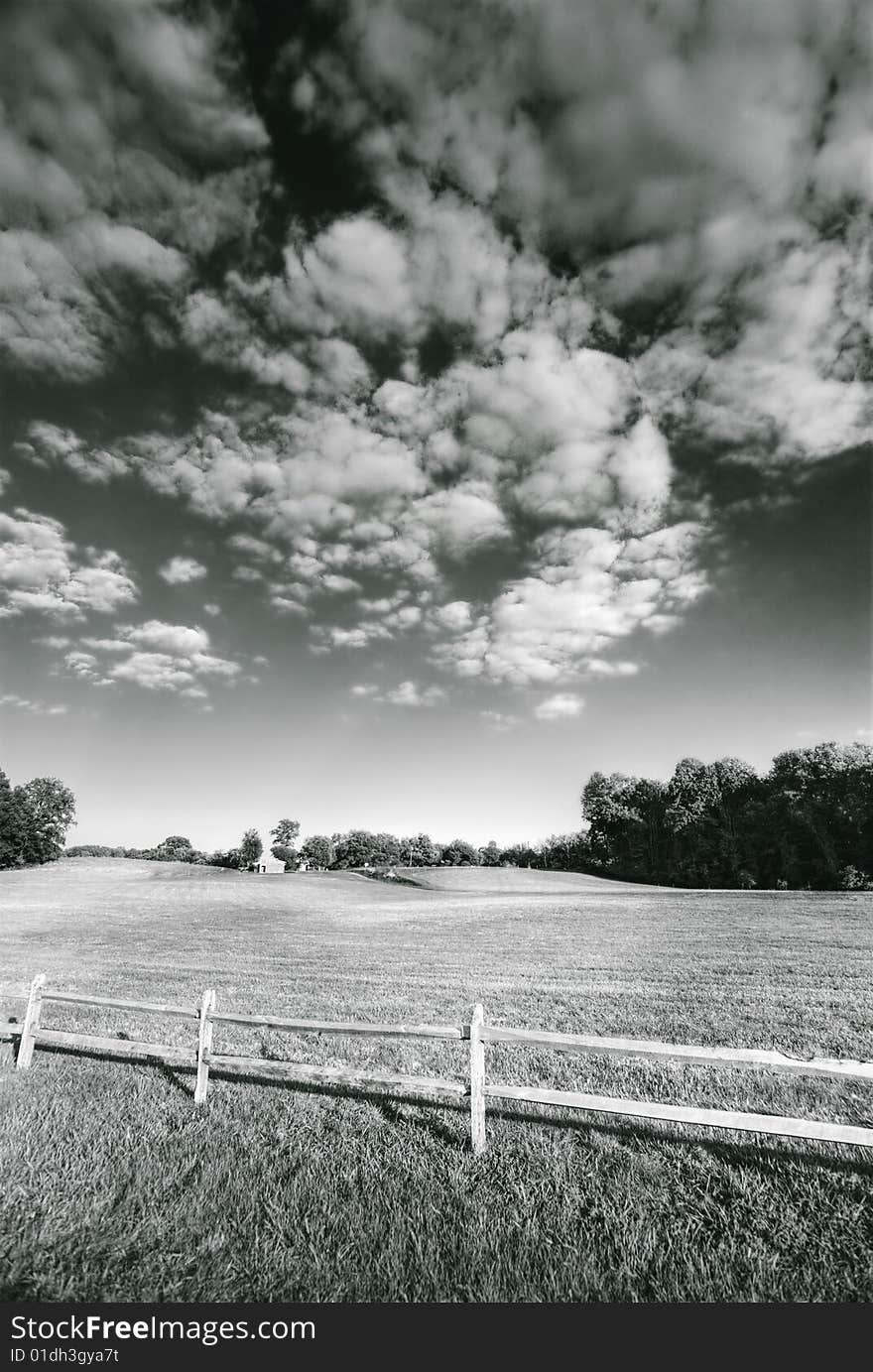 Meadow, sky, cloud and a fence. Meadow, sky, cloud and a fence