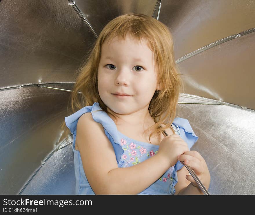 Small pretty girl with umbrella