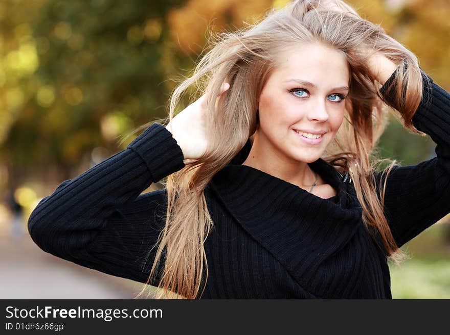 Beautiful Woman In Autumnal Park