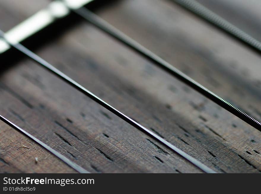 Extreme close-up of guitar neck fretboard and strings. Extreme close-up of guitar neck fretboard and strings