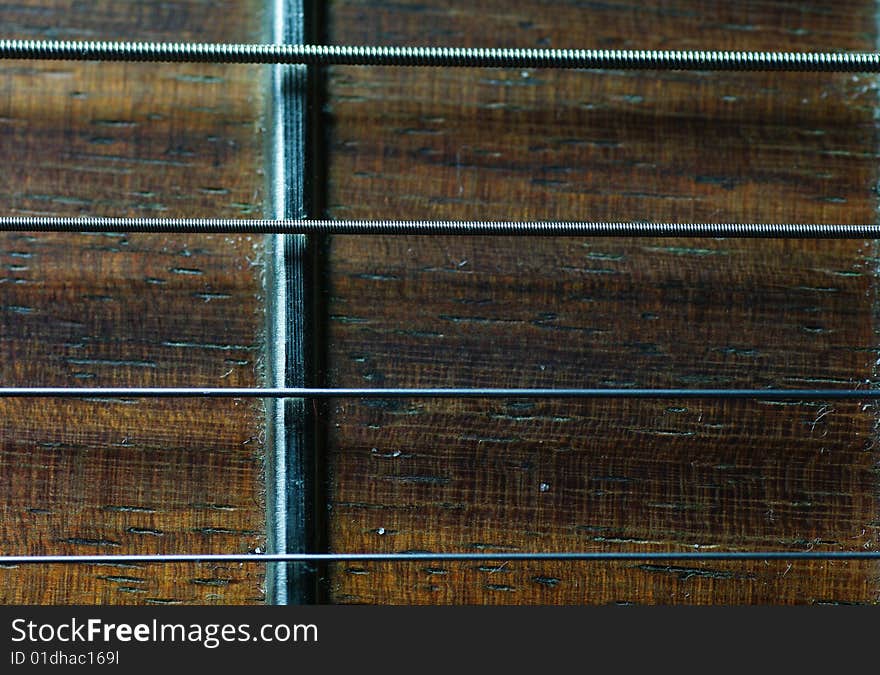 Extreme close-up of guitar neck fretboard and strings. Extreme close-up of guitar neck fretboard and strings