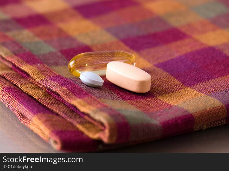 Medicines on a napkin to be taken after a meal. Medicines on a napkin to be taken after a meal