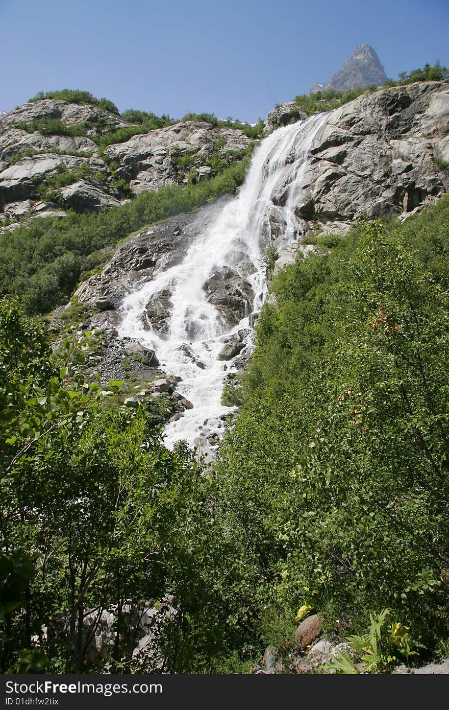 Waterfall in spring season, Caucasus mountains