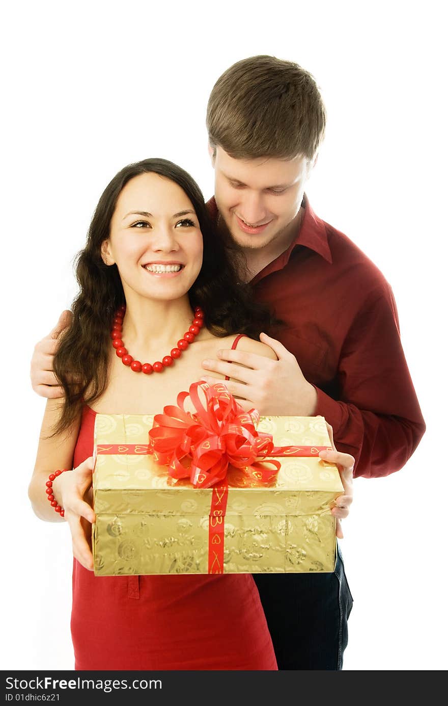 Happy couple, young man gives a present to his wife