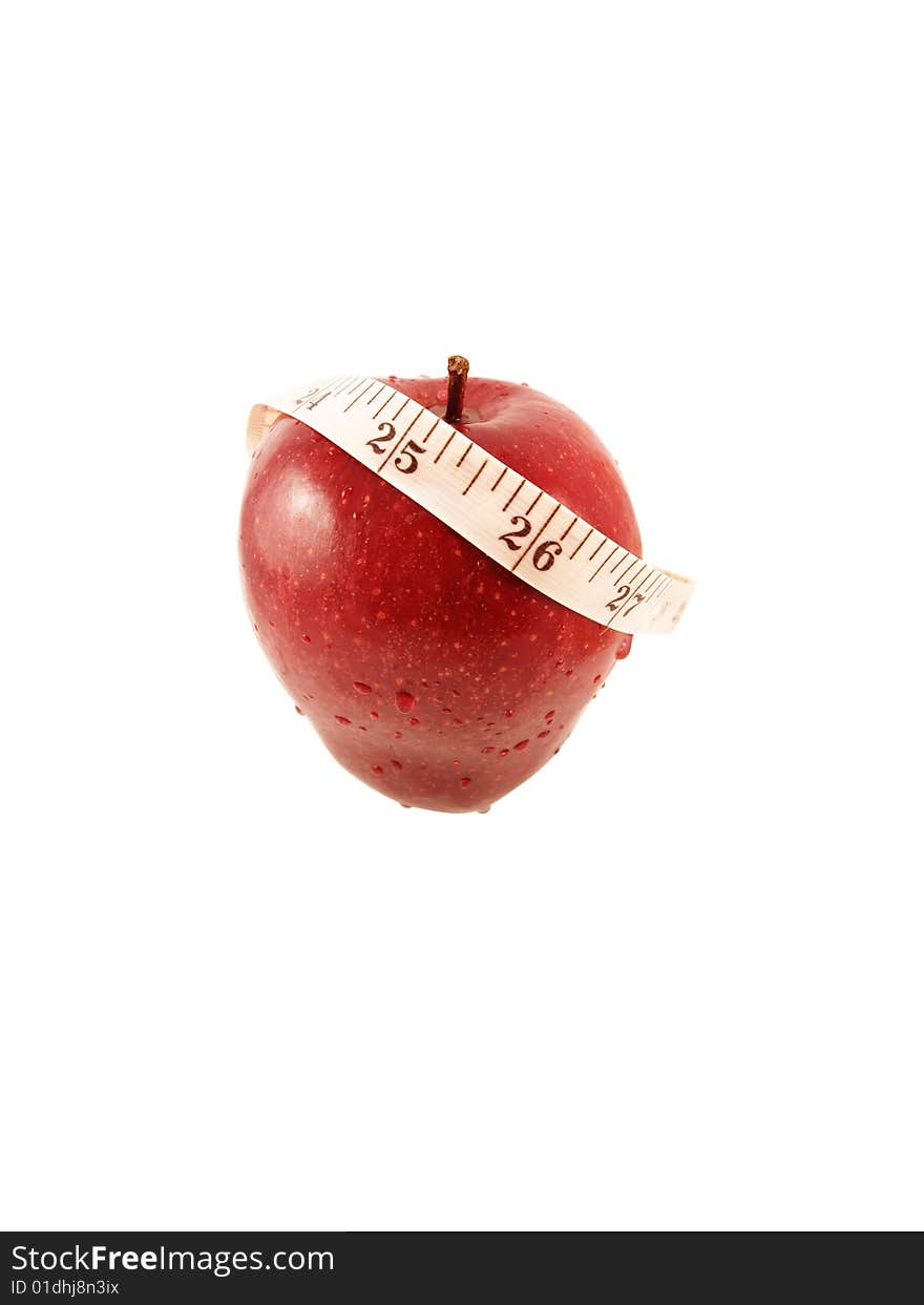 Red apple and measurement tape on white