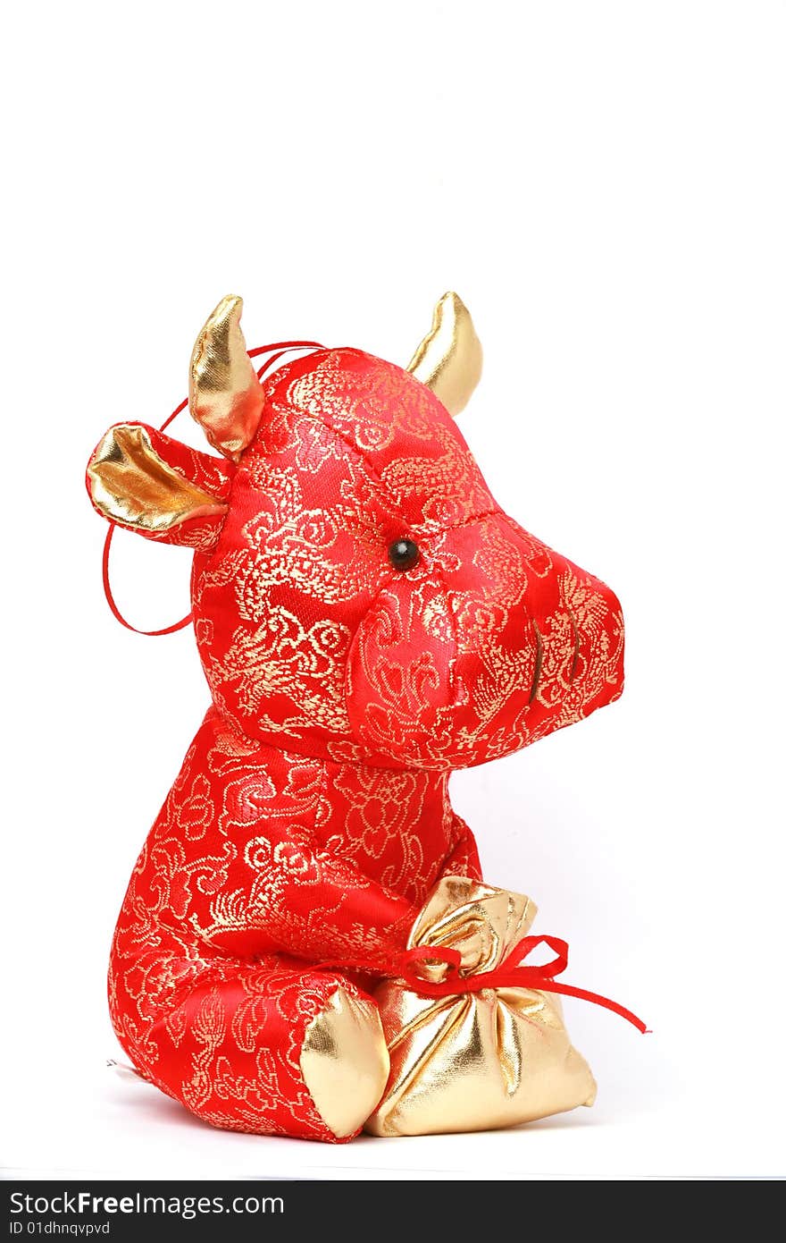 Toy cow for chinese year on white background