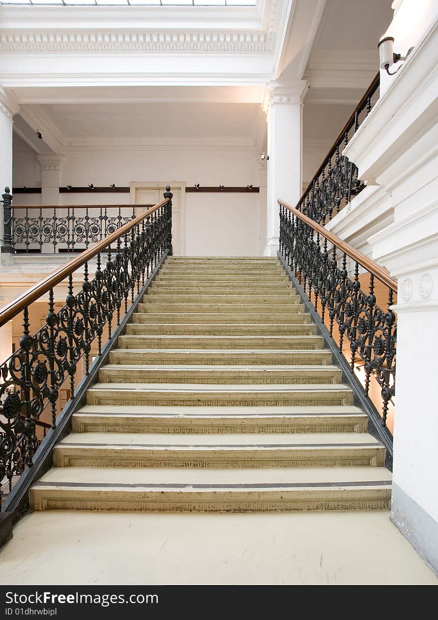 White stairway with metal railing