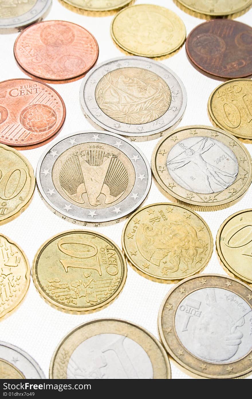 Collection of euro coins on white surface. Collection of euro coins on white surface