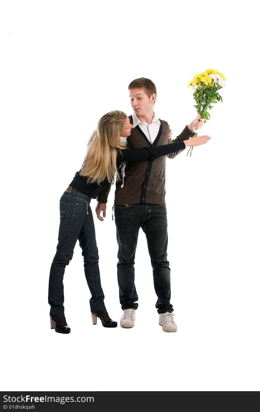 Appointment. The enamoured guy and the girl with a bouquet of yellow flowers