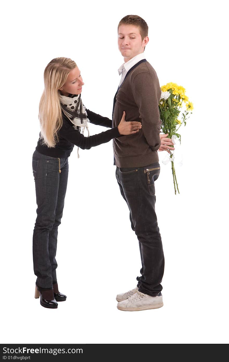 Appointment. The enamoured guy and the girl with a bouquet of yellow flowers. Appointment. The enamoured guy and the girl with a bouquet of yellow flowers