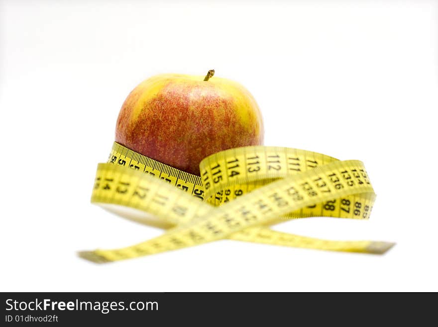 Red apple and tape measure