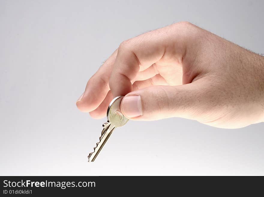 Man handing over a house key. Man handing over a house key