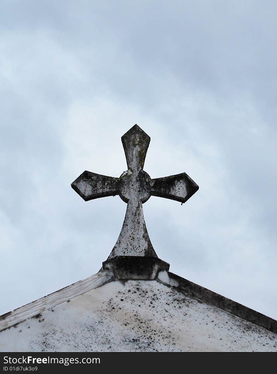 Old cross on the roof of the crypt. Old cross on the roof of the crypt