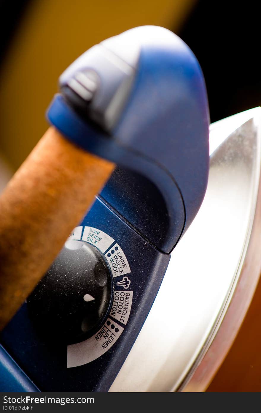 Dusty Iron inside home environment. Focused on temperature control knob.