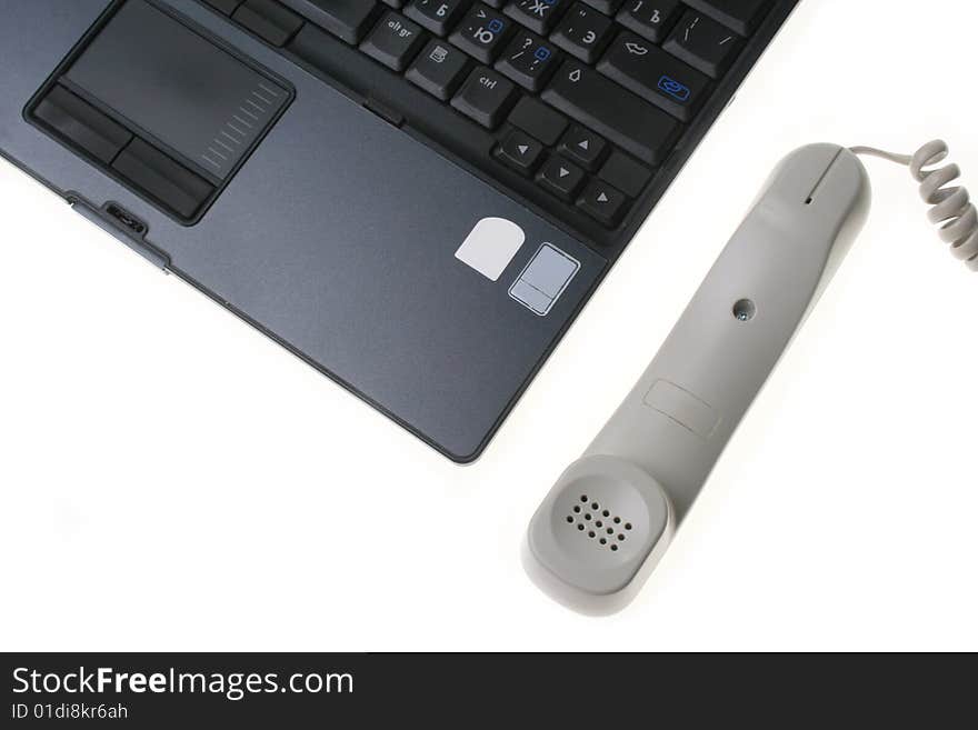 Computer and phone isolated on a white background. Computer and phone isolated on a white background