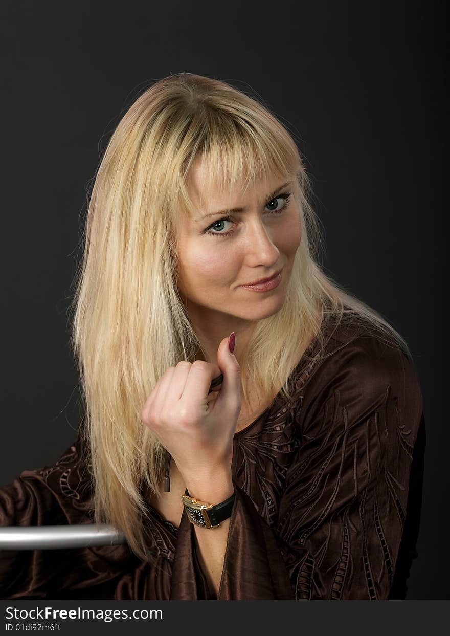 Beauty blonde against a dark background. Beauty blonde against a dark background.