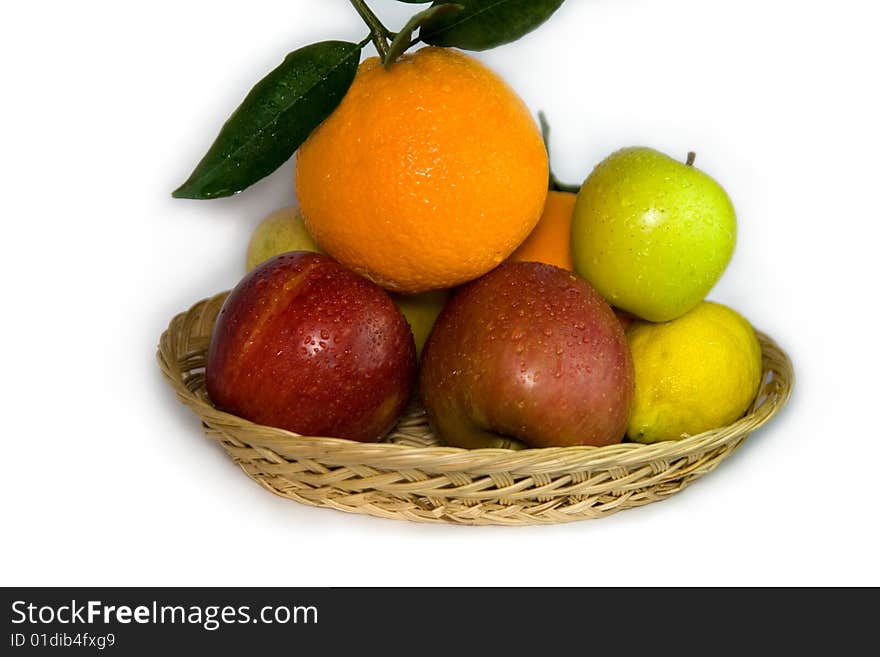 Orange, lemon, apple and plum on white background