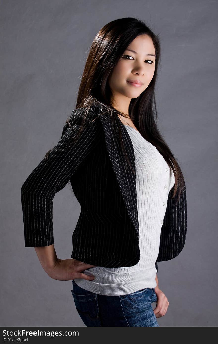 A model wearing jeans and stripes top