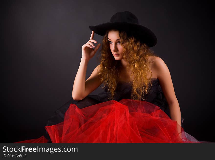 Attractive girl in hat, studio shot